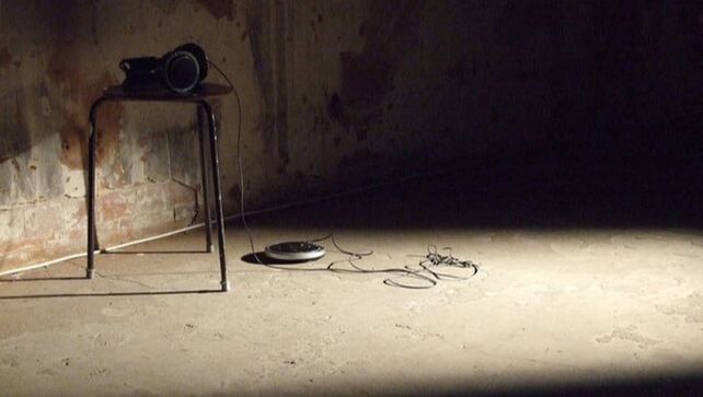Sound art work - headphones on a small stool